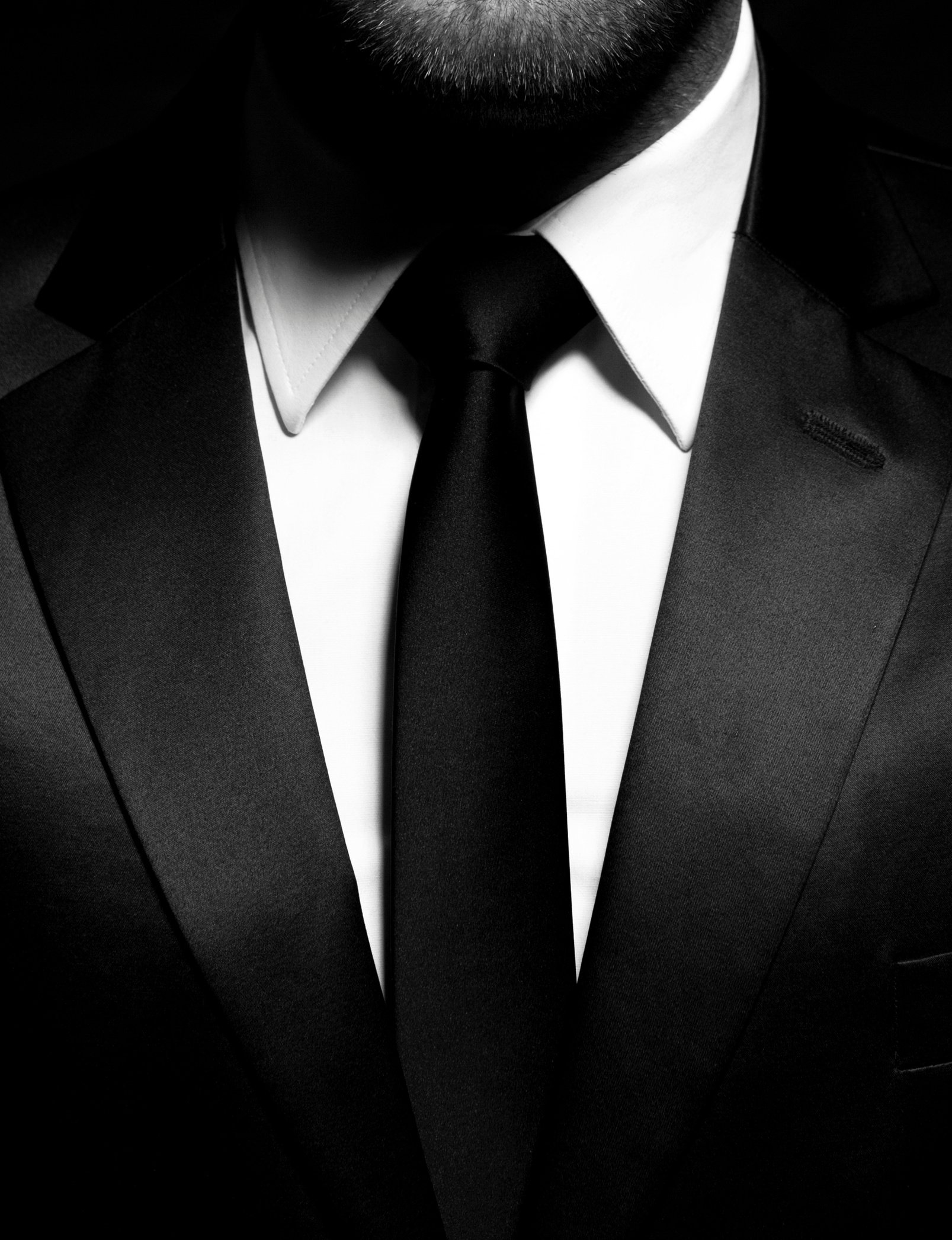 Man gentleman in black suit and tie